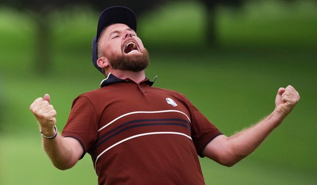 Europe's Shane Lowry react after their match win on the 18th hole at Bethpage Black golf course during the Ryder Cup golf tournament, Saturday, Sept. 27, 2025, in Farmingdale, N.Y. (AP Photo/Matt Slocum)