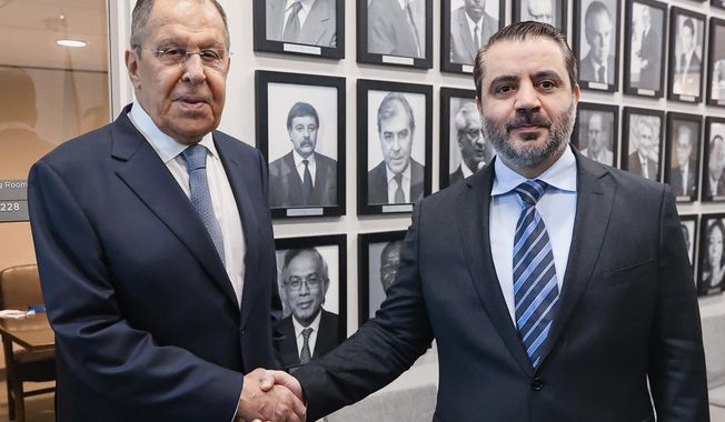 In this photo released by Russian Foreign Ministry Press Service, Syrian Foreign minister Asaad al-Shaibani, right, meets with Russian Foreign Minister Sergey Lavrov as part of the 80th session of the United Nations General Assembly at the Lotte Palace Hotel, on Thursday, Sept. 25, 2025, in New York. (Russian Foreign Ministry Press Service via AP)
