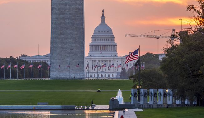 The Capitol and Washington Monument on the National Mall are seen in the distance in Washington, Tuesday, Sept. 23, 2025. (AP Photo/J. Scott Applewhite) ** FILE **