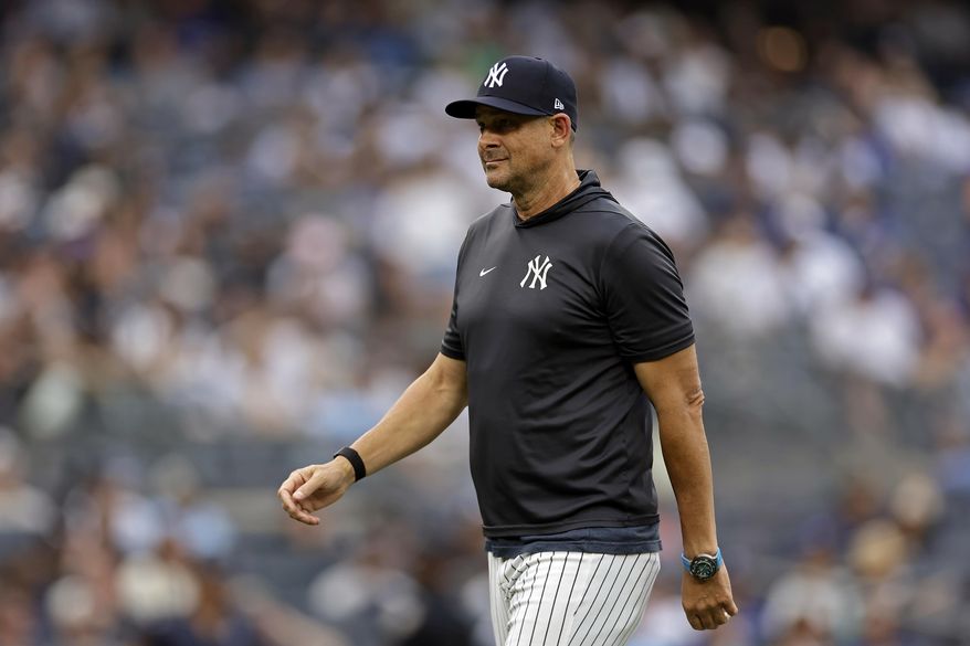New York Yankees manager Aaron Boone (17) walks off the field after a pitching change during the seventh inning of a baseball game against the Toronto Blue Jays, Saturday, Sept. 6, 2025, in New York. (AP Photo/Adam Hunger)