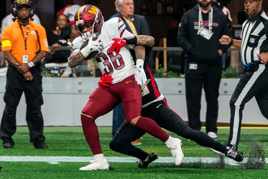 Washington Commanders Running Back Chris Rodriguez (36) rushes for 48 yards at Mercedes-Benz Stadium in Atlanta, Georgia. The Atlanta Falcons defeated the Washington Commanders 34-27 during NFL Week 3 on September 28, 2025. (Photo by Jordan Sabillo for Washington Times)