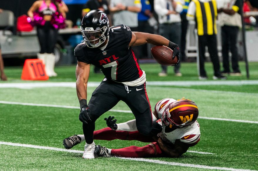 Atlanta Falcons Running Back Bijan Robinson (7) rushes in for a touchdown at Mercedes-Benz Stadium in Atlanta, Georgia. The Atlanta Falcons defeated the Washington Commanders 34-27 during NFL Week 3 on September 28, 2025. (Photo by Jordan Sabillo for Washington Times)