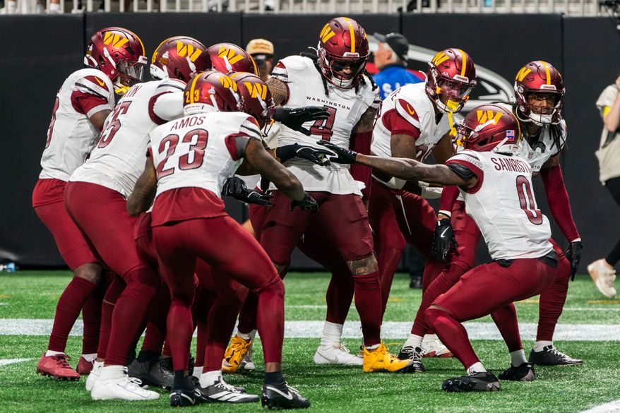 Washington Commanders defense celebrates at Atlanta Falcons end zone after Washington Commanders Defensive Back Mikey Sainristil (0) intercepts pass at Mercedes-Benz Stadium in Atlanta, Georgia. The Atlanta Falcons defeated the Washington Commanders 34-27 during NFL Week 3 on September 28, 2025. (Photo by Jordan Sabillo for Washington Times)