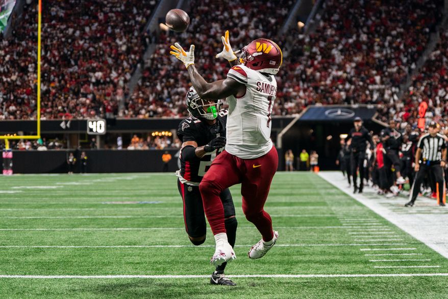 Washington Commanders Wide Receiver Deebo Samuel (1) catches touch down pass thrown by Washington Commanders Quarterback Marcus Mariota (8) at Mercedes-Benz Stadium in Atlanta, Georgia. The Atlanta Falcons defeated the Washington Commanders 34-27 during NFL Week 3 on September 28, 2025. (Photo by Jordan Sabillo for Washington Times)