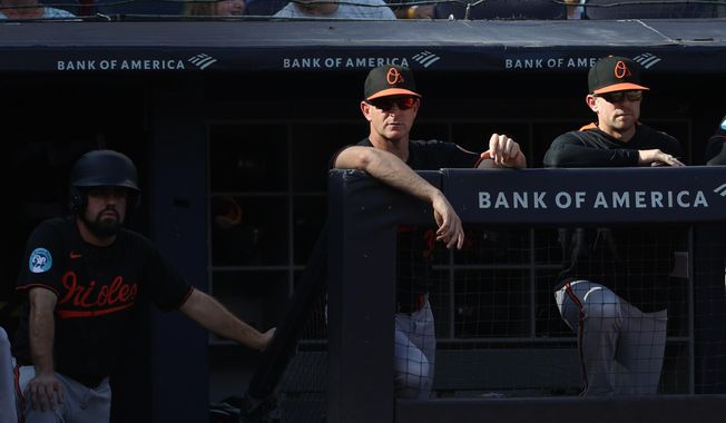 Baltimore Orioles interim manager Tony Mansolino, center, watches from the dugout during the first inning of a baseball game against the New York Yankees, Sunday, Sept. 28, 2025, in New York. (AP Photo/Pamela Smith)