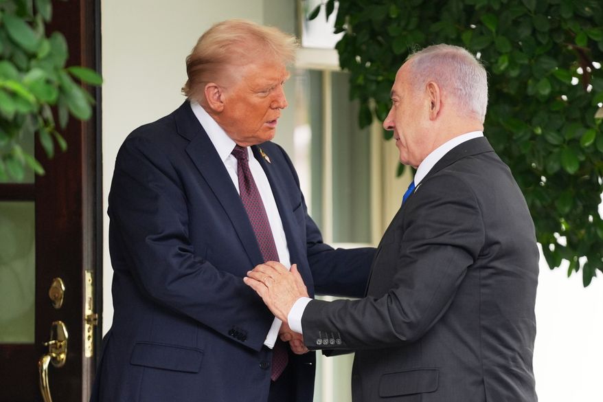 President Donald Trump, left, shakes the hand of Israeli Prime Minister Benjamin Netanyahu at the White House, Monday, Sept. 29, 2025, in Washington. (AP Photo/Evan Vucci)
