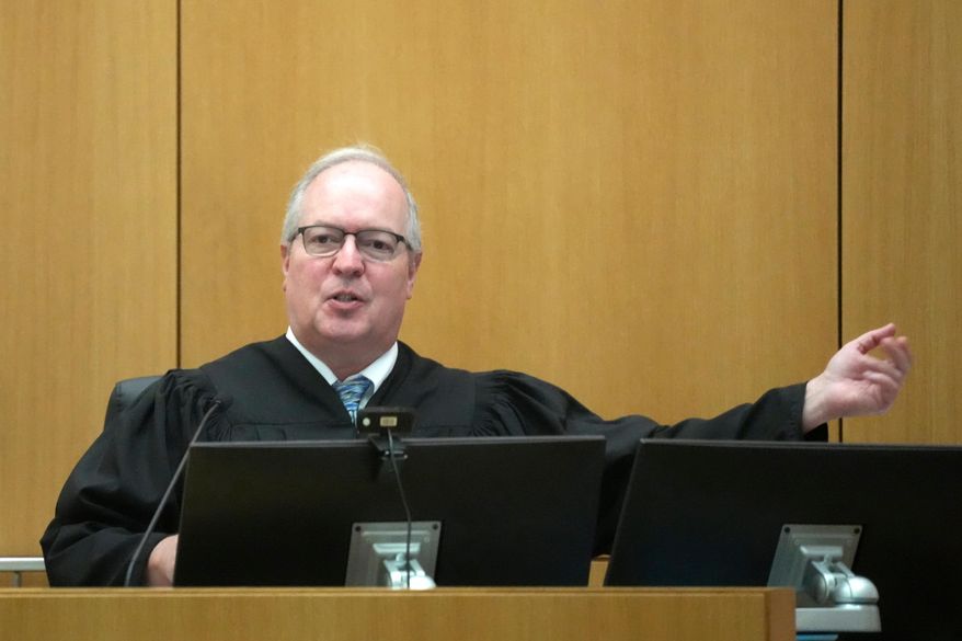 Maricopa County Superior Court Judge Mark H. Brain gestures to a witness during the sentencing hearing of Cleophus Cooksey Jr. after being convicted of killing eight people during his trial Monday, Sept. 29, 2025, in Phoenix. (AP Photo/Ross D. Franklin)