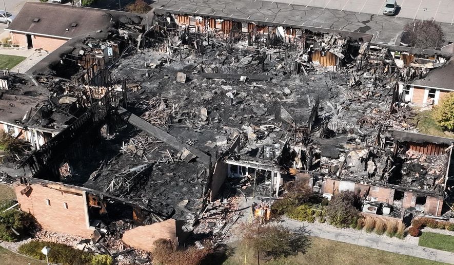 Little remained of The Church of Jesus Christ of Latter-day Saints chapel the day after a former Marine opened fire and set the building ablaze in Grand Blanc Township, Mich., Monday, Sept. 29, 2025. (AP Photo/Mark Vancleave)