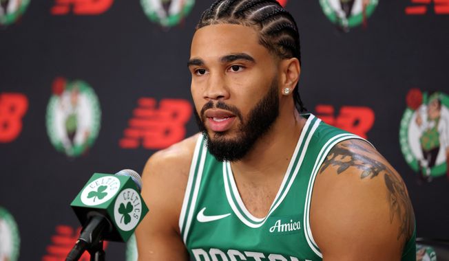 Boston Celtics' Jayson Tatum speaks at a news conference during the NBA basketball team's media day, Monday, Sept. 29, 2025, in Boston. (AP Photo/Michael Dwyer)