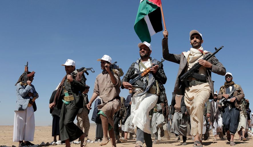 Houthi fighters march during a rally of support for the Palestinians in the Gaza Strip and against the U.S. strikes on Yemen outside Sanaa on Jan. 22, 2024. (AP Photo, File)