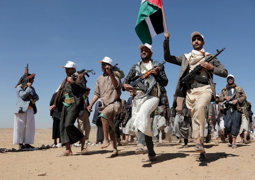 Houthi fighters march during a rally of support for the Palestinians in the Gaza Strip and against the U.S. strikes on Yemen outside Sanaa on Jan. 22, 2024. (AP Photo, File)