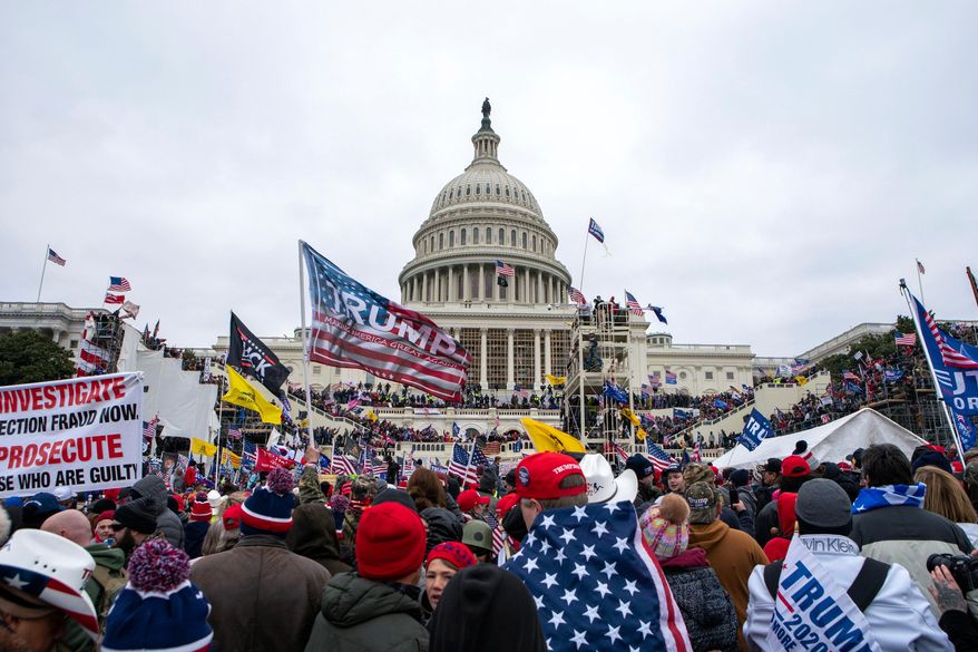 Rioters loyal to President Donald Trump rally at the U.S. Capitol in Washington, Jan. 6, 2021. (AP Photo/Jose Luis Magana, File)
