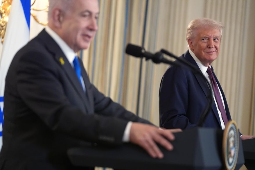 President Donald Trump listens during a news conference with Israeli Prime Minister Benjamin Netanyahu in the State Dining Room of the White House, Monday, Sept. 29, 2025, in Washington. (AP Photo/Evan Vucci)