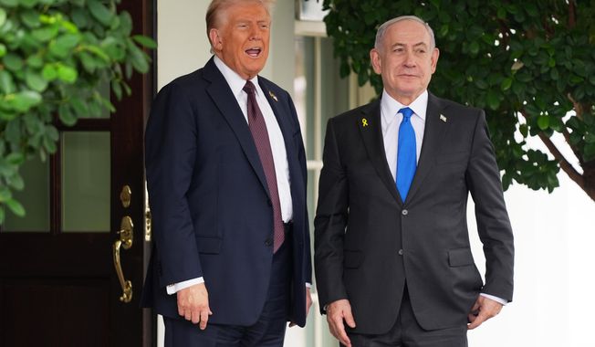 President Donald Trump, left, greets Israeli Prime Minister Benjamin Netanyahu at the White House, Monday, Sept. 29, 2025, in Washington. (AP Photo/Evan Vucci)