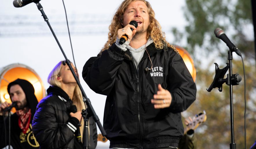Christian musician Sean Feucht of California preaches to the crowd during a rally at the National Mall in Washington, Sunday, Oct. 25, 2020. (AP Photo/Jose Luis Magana, file)