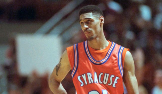 Syracuse's Lawrence Moten reacts after being called for a technical foul after calling a timeout when his team had none left in a game against Arkansas in the second round of the NCAA Midwest Regionals in Austin, Texas, March 19, 1995. (AP Photo/Cliff Schiappa, File). **FILE**