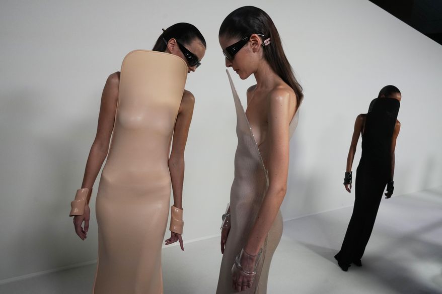 Models wear creations during the First Look as part of the Courreges Spring/Summer 2026 collection presented in Paris, Tuesday, Sept. 30, 2025. (AP Photo/Michel Euler)