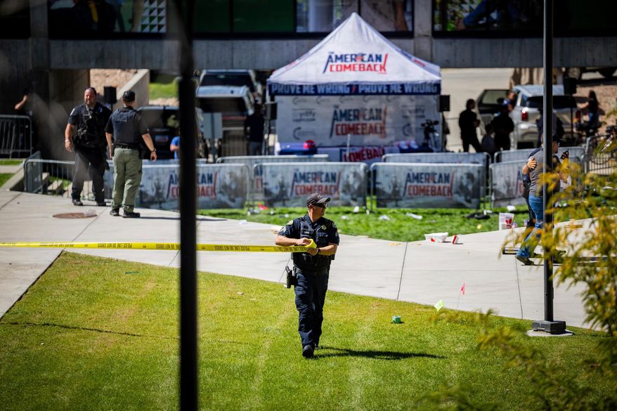 FILE - Law enforcement tapes off an area after Charlie Kirk, the CEO and co-founder of the conservative youth organization Turning Point USA, was shot at Utah Valley University, Wednesday, Sept. 10, 2025, in Orem, Utah. (Tess Crowley/The Deseret News via AP, File)