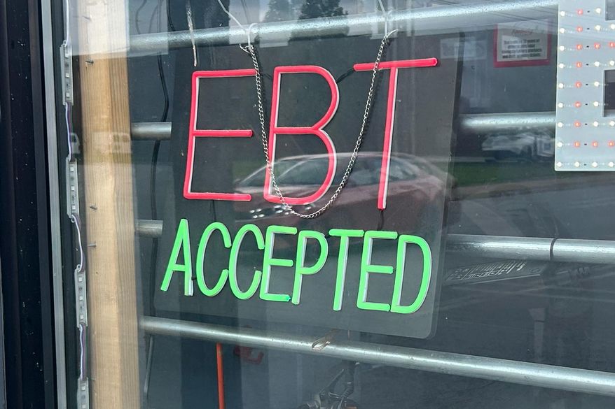 A sign advertises a store accepts Supplemental Nutrition Assistance Program (SNAP/EBT) in Louisville, Ky., on Thursday, Sept. 25, 2025. (Sylvia Goodman/Kentucky Public Radio via AP)