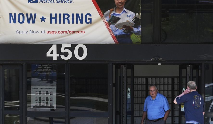 A hiring sign is displayed at a post office in Schaumburg, Ill., Thursday, Sept. 18, 2025. (AP Photo/Nam Y. Huh)