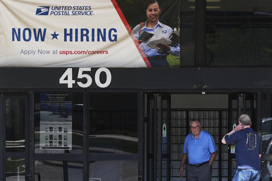 A hiring sign is displayed at a post office in Schaumburg, Ill., Thursday, Sept. 18, 2025. (AP Photo/Nam Y. Huh)