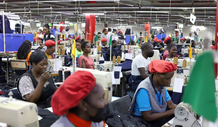 FILE - Factory workers operate machines to make garments at United Aryan EPZ Limited in Ruaraka on the outskirts of Nairobi, Kenya, March 21, 2025. (AP Photo/Andrew Kasuku, File)