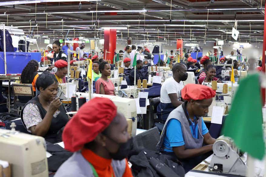 FILE - Factory workers operate machines to make garments at United Aryan EPZ Limited in Ruaraka on the outskirts of Nairobi, Kenya, March 21, 2025. (AP Photo/Andrew Kasuku, File)