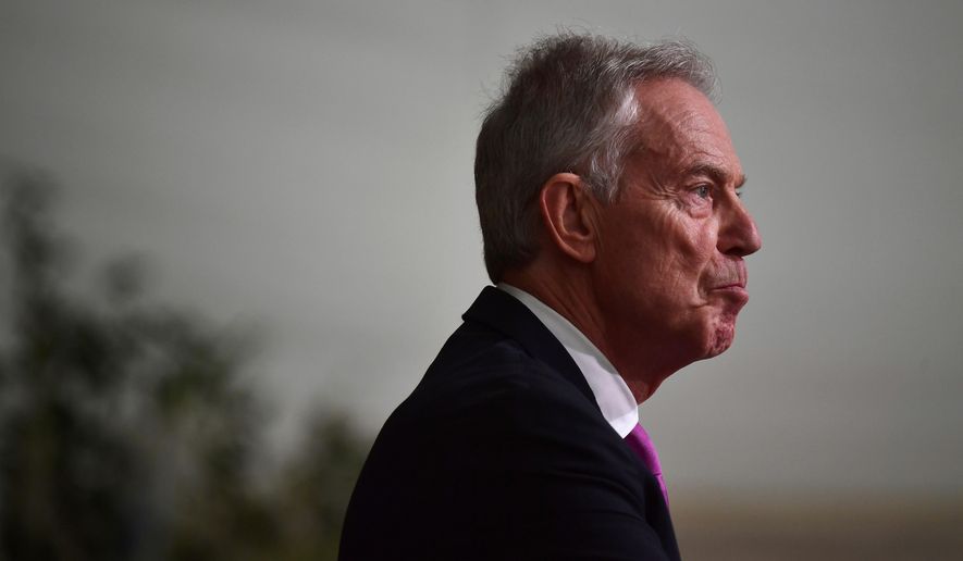 FILE - Former British Prime Minister Sir Tony Blair reacts as he gives a speech at Hillsborough Castle for the Gala dinner to mark the 25th anniversary of the Belfast/Good Friday Agreement, in Belfast, Northern Ireland, April 19, 2023. (Charles McQuillan/Pool Photo via AP, File)