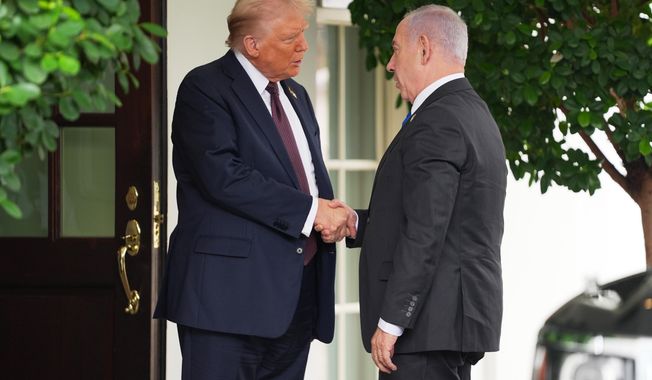President Donald Trump, left, shakes the hand of Israeli Prime Minister Benjamin Netanyahu at the White House, Monday, Sept. 29, 2025, in Washington. (AP Photo/Evan Vucci)