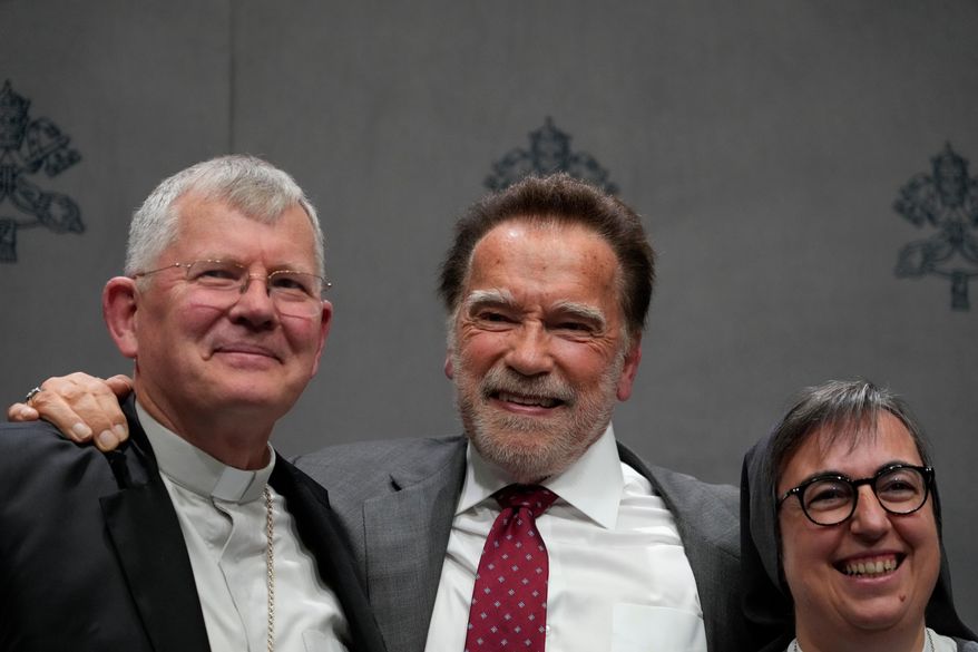 From left, Cardinal Jaime Spengler, former California Gov. Arnold Schwarzenegger, and sister Alessandra Smerilli pose for photographers at the end of a press conference at the Vatican, Tuesday, Sept. 30, 2025, to present the "Raising Hope for Climate Justice Conference," promoted by the Laudato Si' (Praise Be to You) Movement, which was inspired by the late Pope Francis' encyclical letter of the same name. (AP Photo/Gregorio Borgia)