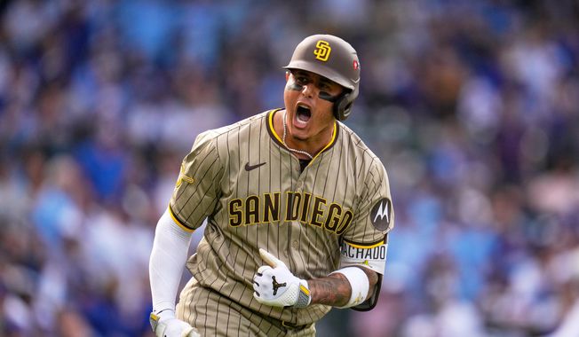 San Diego Padres' Manny Machado is reacts after hitting a two-run home run during the fifth inning of Game 2 of a National League wild card baseball game Wednesday, Oct. 1, 2025, in Chicago. (AP Photo/Erin Hooley)