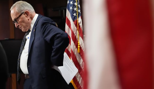 Senate Minority Leader Chuck Schumer of N.Y., listens as he speaks to reporters Tuesday, Sept. 30, 2025, at the U.S. Capitol in Washington. (AP Photo/Jacquelyn Martin)