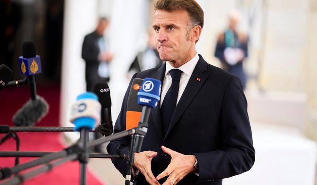 French President Emmanuel Macron arrives at an informal summit in the Danish parliament at Christiansborg Castle in Copenhagen, Wednesday, Oct. 1, 2025. (Thomas Traasdahl/Ritzau Scanpix via AP)