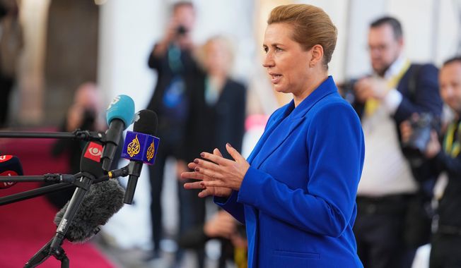 Denmark's Prime Minister Mette Frederiksen speaks to journalists as she arrives for an informal summit in the Danish parliament at Christiansborg Castle in Copenhagen, on Wednesday, Oct. 1, 2025. (Thomas Traasdahl/Ritzau Scanpix via AP)