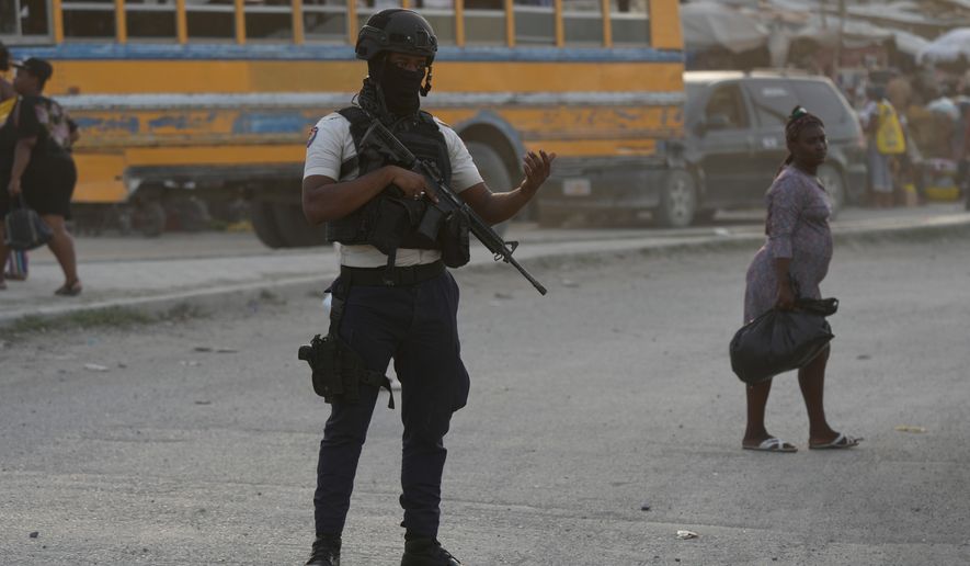 An intersection in Port-au-Prince, Haiti, Tuesday, Sept. 30, 2025. (AP Photo/Odelyn Joseph)