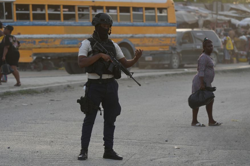 An intersection in Port-au-Prince, Haiti, Tuesday, Sept. 30, 2025. (AP Photo/Odelyn Joseph)