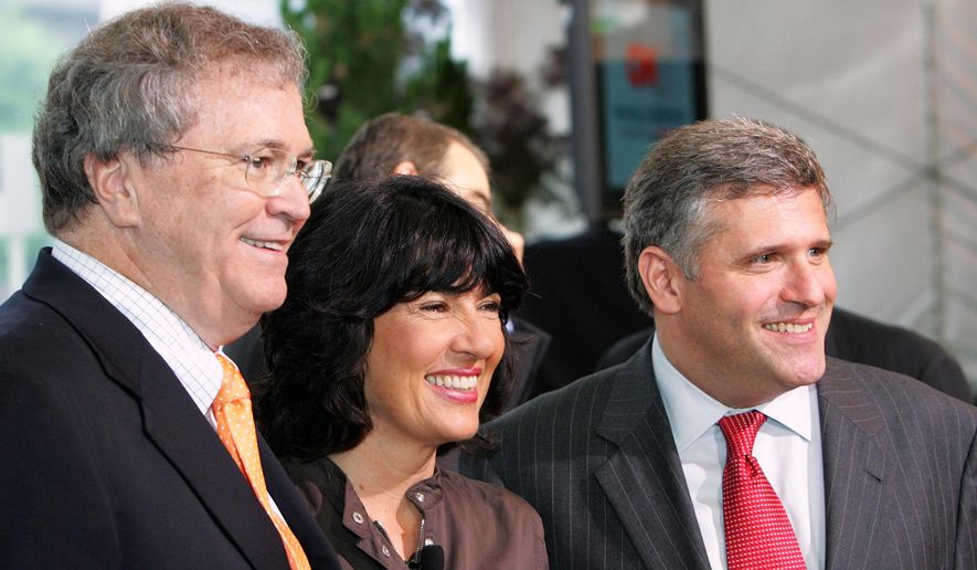 Retired CNN News Group Chairman and CEO Tom Johnson, left, CNN Chief International Correspondent Christiane Amanpour, center, and CEO and Chairman of Turner Broadcasting System Phil Kent pose together at the CNN 25 World Report Conference in Atlanta on June 1, 2005. (AP Photo/Ric Feld, File)