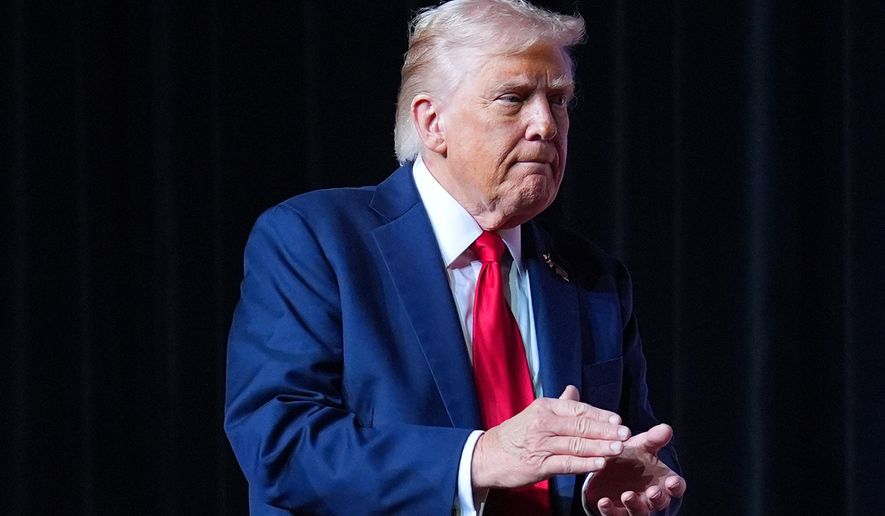 President Donald Trump walking off stage after speaking to a gathering of top U.S. military commanders at Marine Corps Base Quantico, Tuesday, Sept. 30, 2025, in Quantico, Va. (AP Photo/Evan Vucci)