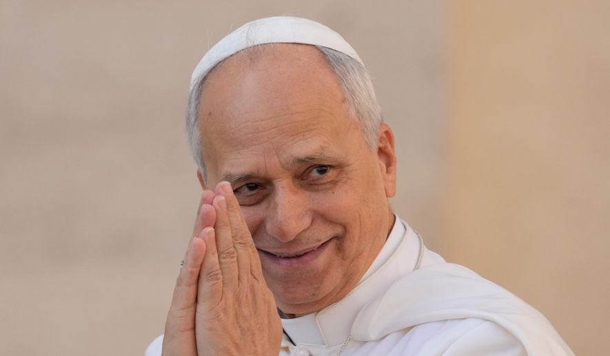 Pope Leo XIV gestures as he arrives for his weekly general audience in St. Peter's Square at The Vatican, Wednesday, Oct.1, 2025. (AP Photo/Gregorio Borgia)