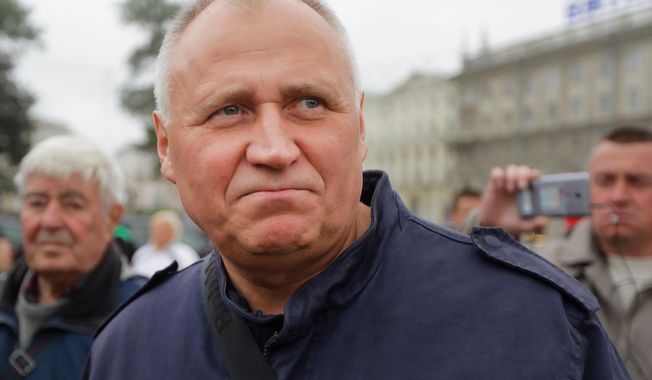 FILE - Veteran Belarusian opposition activist Mikalai Statkevich is seen at a protest in Minsk, Belarus, on Sept. 8, 2017. (AP Photo, File)