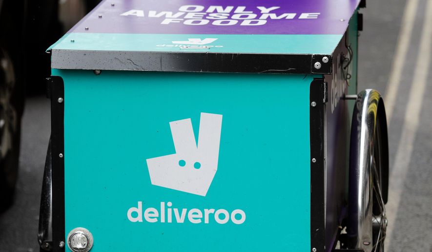 FILE - This July 11, 2017 file photo, shows a deliveroo logo on a bicycle in London. (AP Photo/Frank Augstein, File)