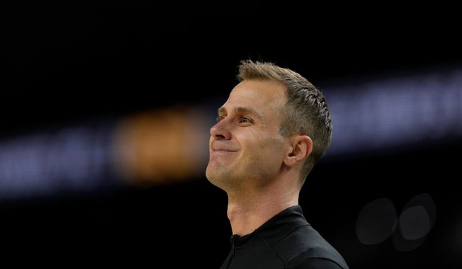 FILE - Duke head coach Jon Scheyer watches during the first half against the Houston in the national semifinals at the Final Four of the NCAA college basketball tournament, April 5, 2025, in San Antonio. (AP Photo/Brynn Anderson, file)