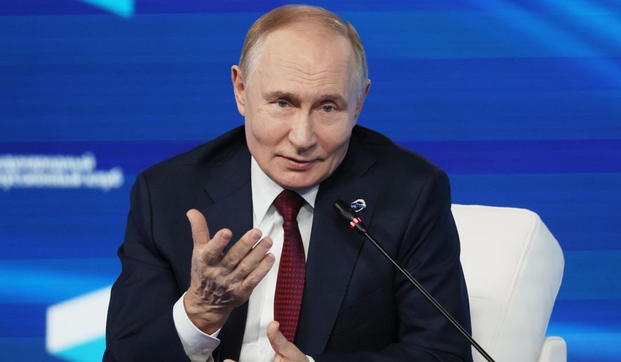 Russian President Vladimir Putin gestures as he answers questions during a meeting with foreign policy experts at the Valdai Discussion Club in the Black Sea resort of Sochi, Russia, on Thursday, Oct. 2, 2025. (Mikhail Metzel, Sputnik, Kremlin Pool Photo via AP) ** FILE **