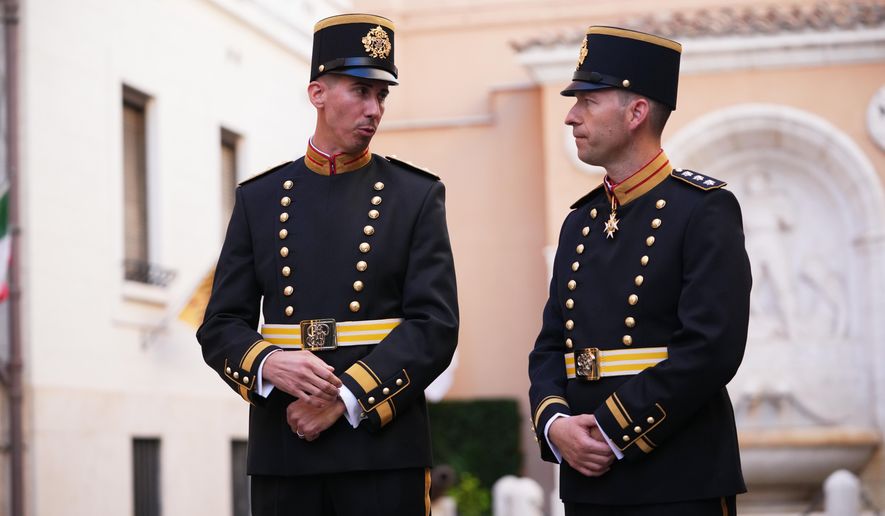 Lieutenant Colonel Loic Marc Rossier, left, and Captain Lorenz Keusch pose for reporters as they present the Swiss Guard Mezza-Gala uniform in the Swiss Guard Barracks at the Vatican, Thursday, Oct. 2, 2025. (AP Photo/Alessandra Tarantino)