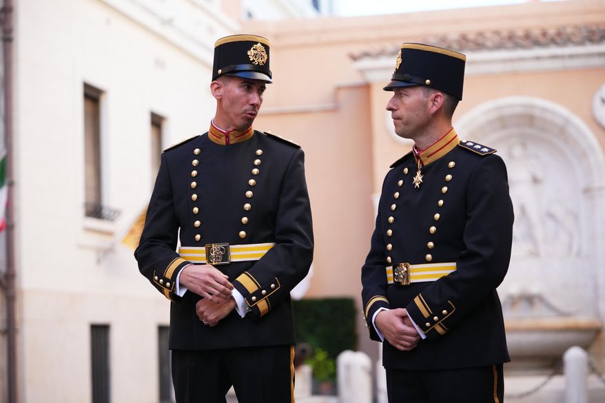 Lieutenant Colonel Loic Marc Rossier, left, and Captain Lorenz Keusch pose for reporters as they present the Swiss Guard Mezza-Gala uniform in the Swiss Guard Barracks at the Vatican, Thursday, Oct. 2, 2025. (AP Photo/Alessandra Tarantino)