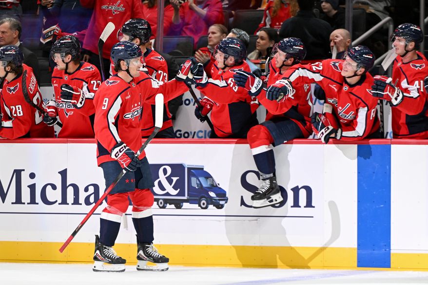 Washington Capitals forward Ryan Leonard (9) getting congratulated by teammates after scoring a goal during the first period of a preseason NHL game against the Boston Bruins at Capital One Arena in Washington D.C., October 2, 2025. (Photo for the Washington Times)
