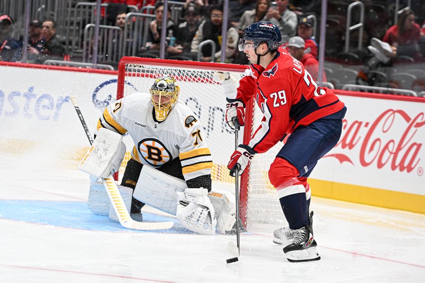 Washington Capitals forward Hendrix Lapierre (29) with the puck in front of the net during the second period of a preseason NHL game against the Boston Bruins at Capital One Arena in Washington D.C., October 2, 2025. (Photo for the Washington Times)