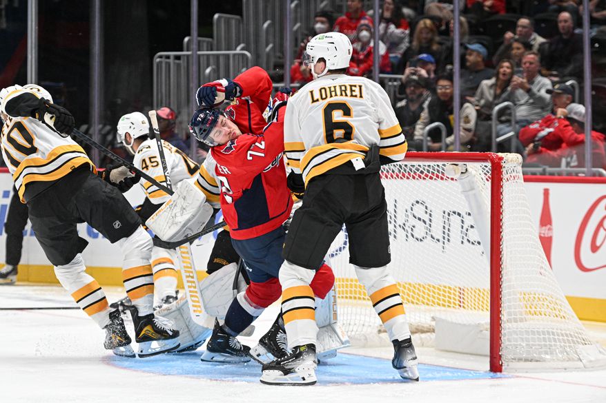 Washington Capitals left wing Anthony Beauvillier (72) reacting after getting knocked in the face by Boston Bruins defenseman Mason Lohrei (6) during the second period of a preseason NHL game at Capital One Arena in Washington D.C., October 2, 2025. (Photo for the Washington Times)