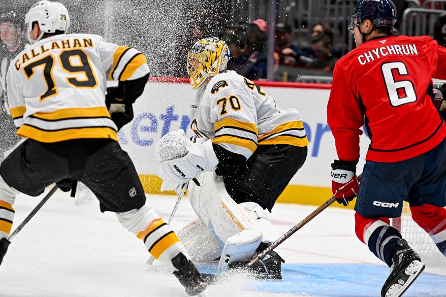 Boston Bruins goalie Joonas Korpisalo (70) getting sprayed with snow during the second period of a preseason NHL game against the Washington Capitals at Capital One Arena in Washington D.C., October 2, 2025. (Photo for the Washington Times)