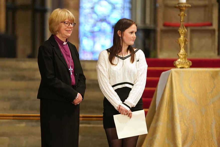 Sarah Mullally, the new Archbishop of Canterbury, left, spiritual leader of the world's 85 million Anglicans, inside Canterbury Cathedral ahead of a media conference in Canterbury, England, Friday, Oct. 3, 2025. (AP Photo/Alberto Pezzali)